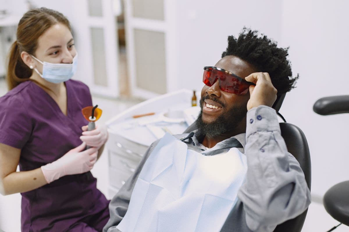 Patient wearing protective glasses during a dental procedure